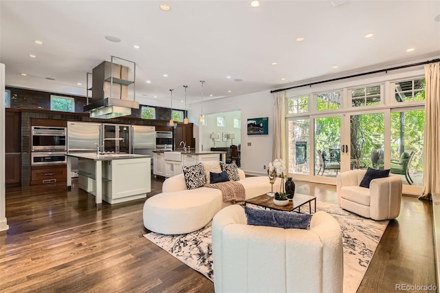 235 Eudora St, Denver, CO 80220 - living room with dark wood-style flooring and recessed lighting