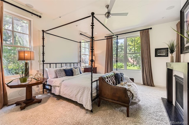 235 Eudora St, Denver, CO 80220 - carpeted bedroom featuring baseboards and a fireplace with flush hearth