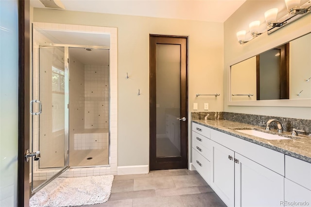 235 Eudora St, Denver, CO 80220 - full bath with vanity, a stall shower, and tile patterned flooring