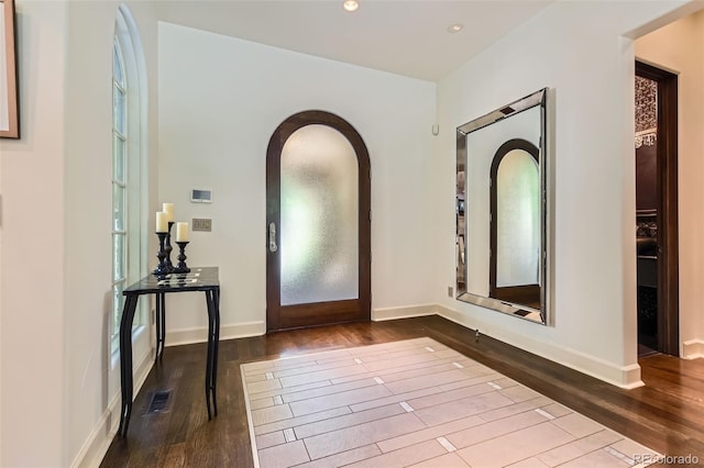 235 Eudora St, Denver, CO 80220 - entryway with dark wood finished floors, recessed lighting, and arched walkways