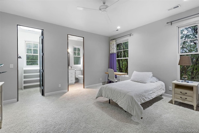 235 Eudora St, Denver, CO 80220 - carpeted bedroom featuring connected bathroom, recessed lighting, and a ceiling fan