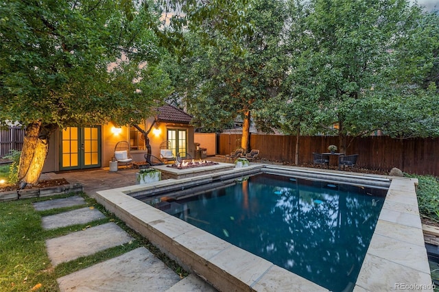 235 Eudora St, Denver, CO 80220 - view of swimming pool featuring french doors, a fenced backyard, and a patio