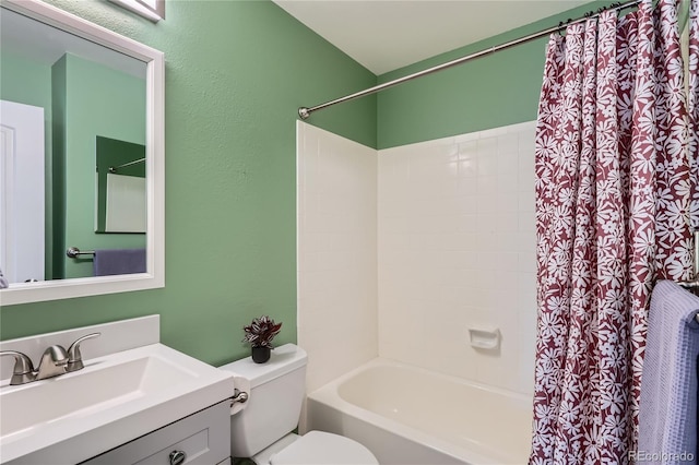 full bathroom with vanity, shower / bath combination with curtain, and toilet