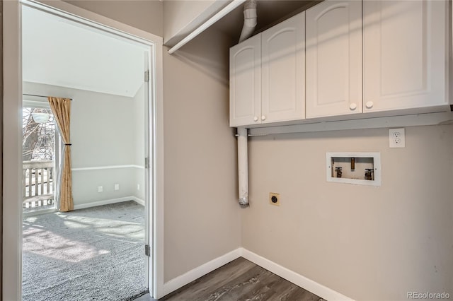 clothes washing area featuring dark colored carpet, cabinets, hookup for a washing machine, and electric dryer hookup