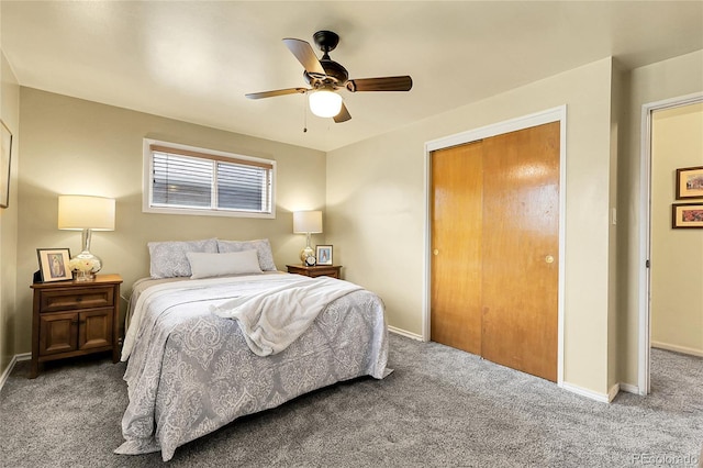 bedroom with carpet floors, baseboards, ceiling fan, and a closet