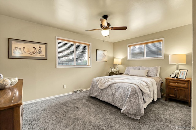 bedroom with carpet floors, a ceiling fan, baseboards, and visible vents