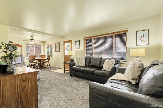 living area with carpet flooring and a ceiling fan
