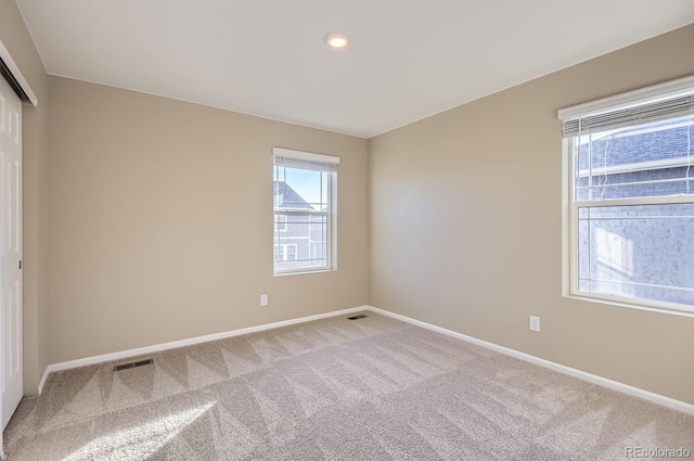 unfurnished room featuring carpet floors