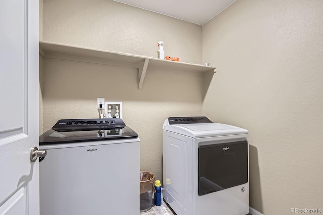 clothes washing area with independent washer and dryer