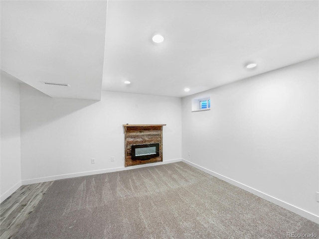 unfurnished living room with carpet