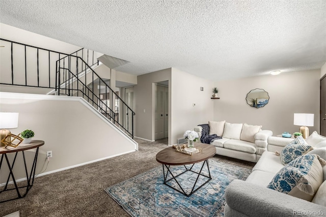 carpeted living room with a textured ceiling