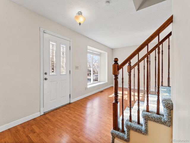 entryway with wood-type flooring