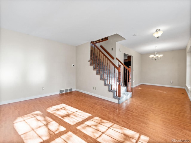 interior space with a chandelier and light wood-type flooring