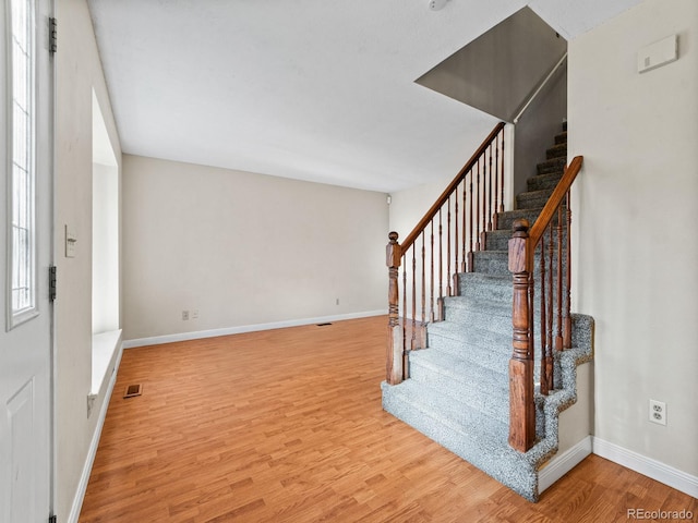 entrance foyer with light hardwood / wood-style flooring