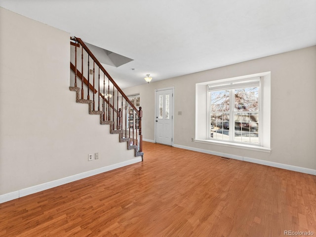 interior space with hardwood / wood-style floors