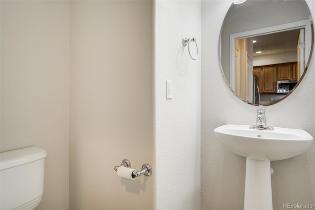 7046 Red Sand Grv, Colorado Springs, CO 80923 - bathroom featuring toilet