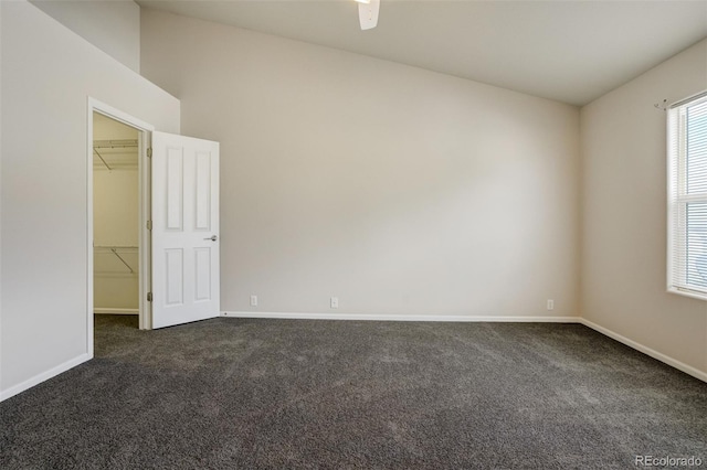 7046 Red Sand Grv, Colorado Springs, CO 80923 - empty room with dark carpet, baseboards, and ceiling fan