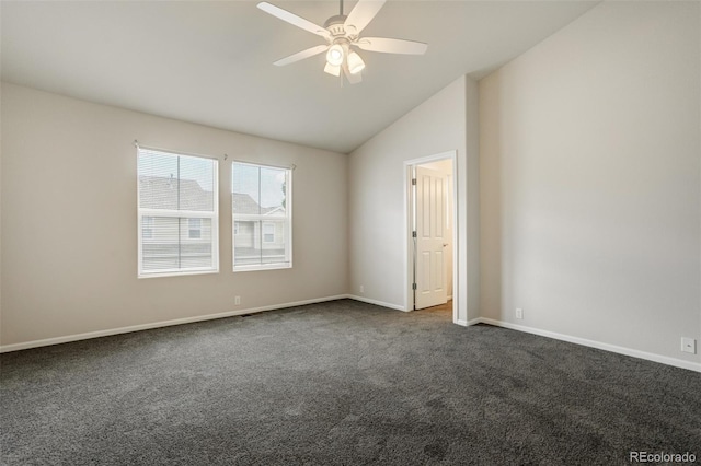 7046 Red Sand Grv, Colorado Springs, CO 80923 - spare room featuring dark carpet, a ceiling fan, vaulted ceiling, and baseboards