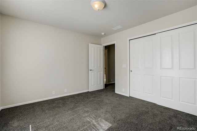 7046 Red Sand Grv, Colorado Springs, CO 80923 - unfurnished bedroom featuring dark carpet, baseboards, and a closet