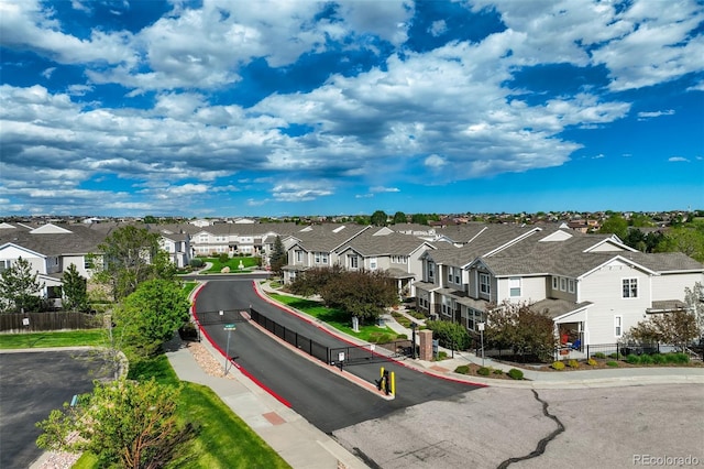 7046 Red Sand Grv, Colorado Springs, CO 80923 - view of asphalt street with a residential view, curbs, and sidewalks
