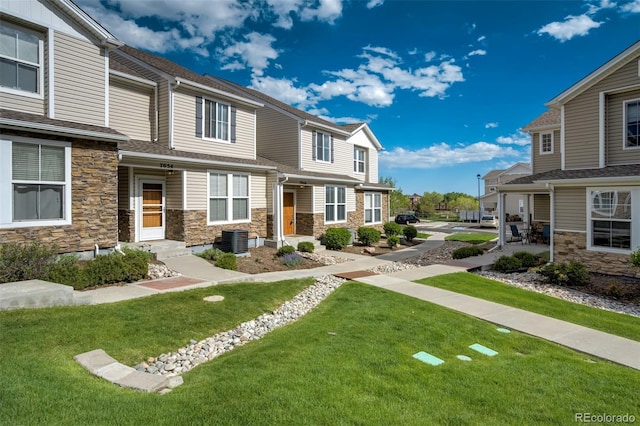 7046 Red Sand Grv, Colorado Springs, CO 80923 - view of green lawn with central AC unit