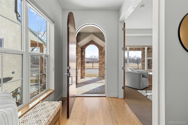 doorway to outside with light wood-type flooring