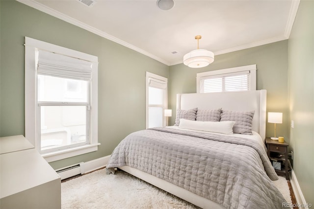 bedroom with a baseboard heating unit, multiple windows, ornamental molding, and baseboards