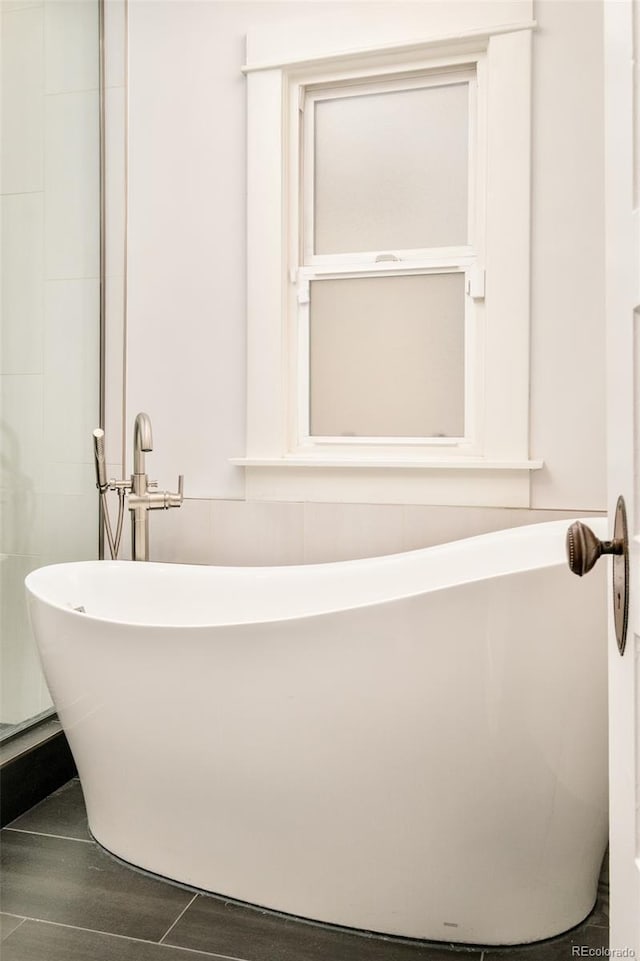 bathroom featuring a freestanding bath