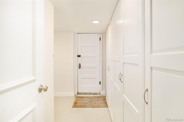 corridor featuring tile patterned flooring and recessed lighting