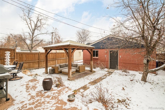 exterior space featuring fence, outdoor lounge area, and a gazebo