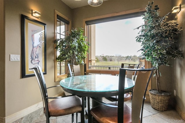 dining area with light tile patterned flooring