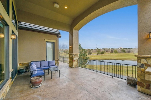 view of patio / terrace featuring outdoor lounge area and a water view