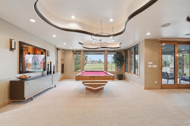 playroom with a raised ceiling, light carpet, and pool table