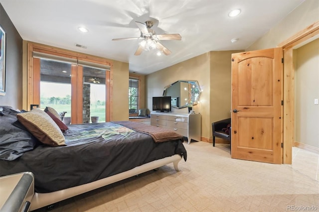 bedroom featuring light carpet and ceiling fan