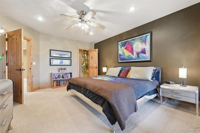 carpeted bedroom with ceiling fan