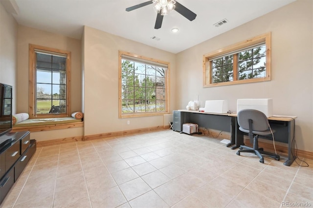 tiled office space featuring ceiling fan