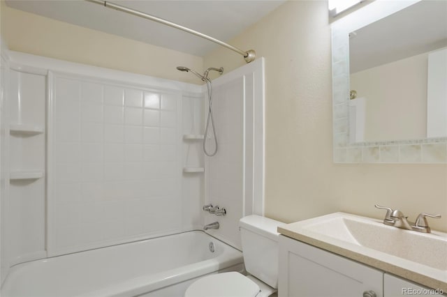 full bathroom featuring washtub / shower combination, vanity, and toilet