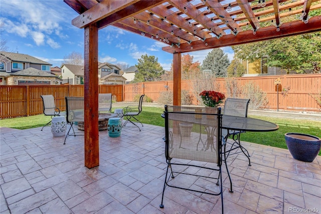 view of patio / terrace featuring a pergola and a fire pit