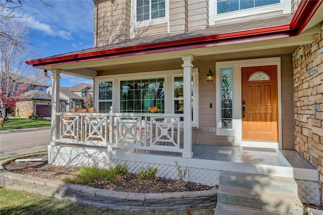 doorway to property featuring covered porch