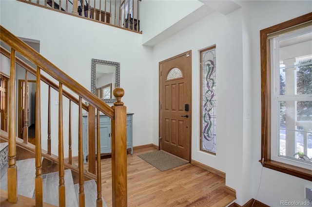 foyer entrance with light hardwood / wood-style floors