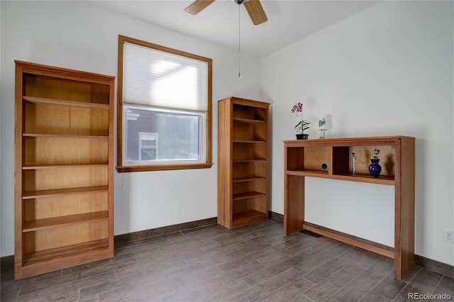 interior space with ceiling fan