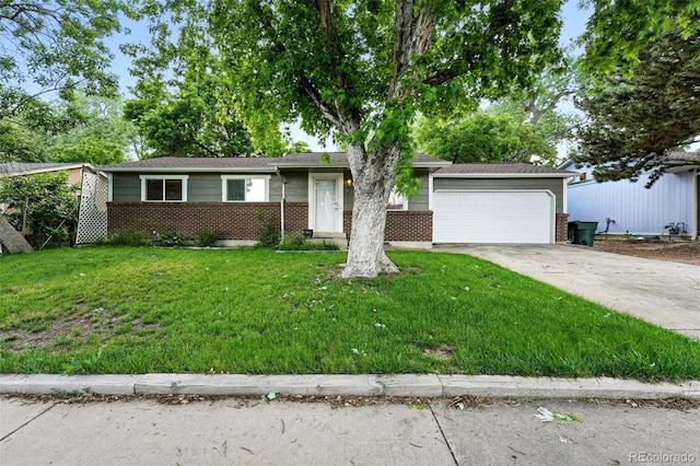 11625 Bellaire Way, Thornton, CO 80233 - single story home featuring brick siding, a garage, concrete driveway, and a front lawn