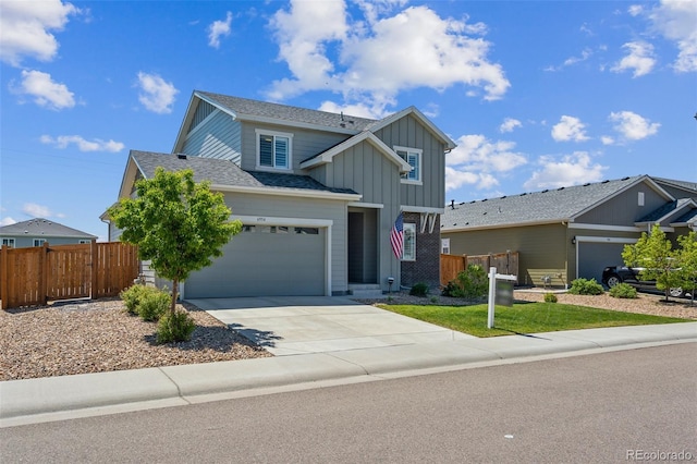 6954 E 117th Ave, Thornton, CO 80233 - traditional home with board and batten siding, driveway, roof with shingles, and a garage