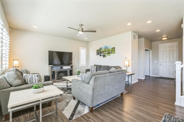 6954 E 117th Ave, Thornton, CO 80233 - living room featuring a ceiling fan, dark wood-style floors, recessed lighting, baseboards, and a fireplace