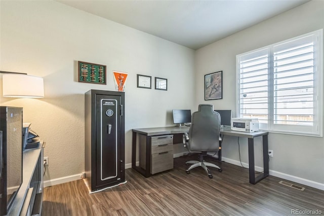 6954 E 117th Ave, Thornton, CO 80233 - home office featuring dark wood-type flooring and baseboards