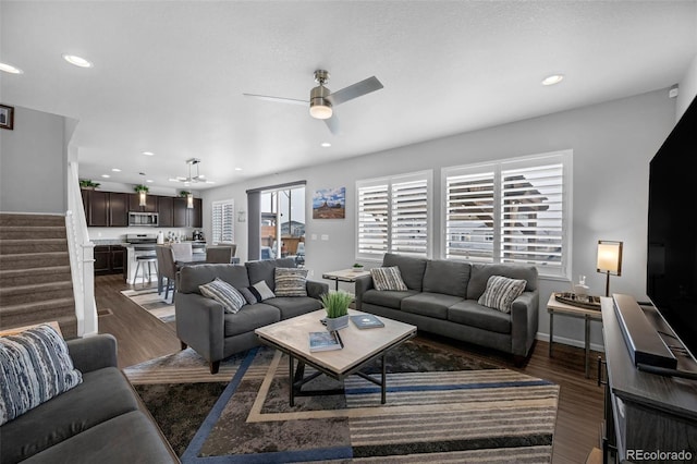 6954 E 117th Ave, Thornton, CO 80233 - living room featuring wood finished floors, stairway, a ceiling fan, recessed lighting, and baseboards