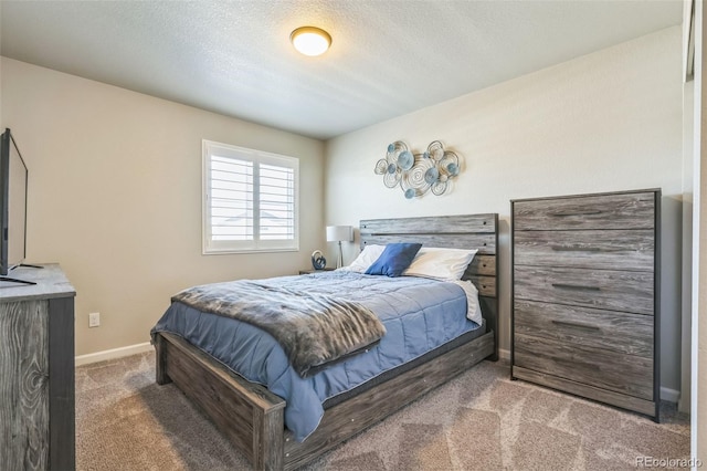 6954 E 117th Ave, Thornton, CO 80233 - carpeted bedroom featuring baseboards and a textured ceiling