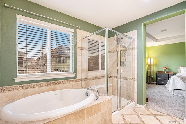 10247 Telluride Way, Commerce City, CO 80022 - bathroom featuring a bath, connected bathroom, a stall shower, and healthy amount of natural light
