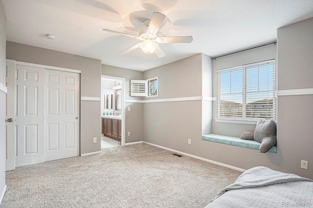 10247 Telluride Way, Commerce City, CO 80022 - bedroom with carpet, ceiling fan, ensuite bathroom, and a closet