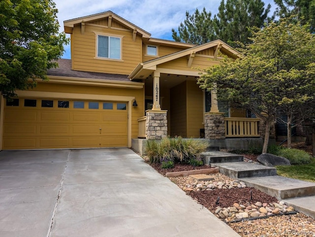10247 Telluride Way, Commerce City, CO 80022 - craftsman house with driveway, a garage, a porch, and stone siding